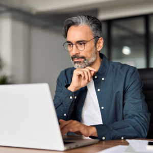 Man sitting in front of his laptop.